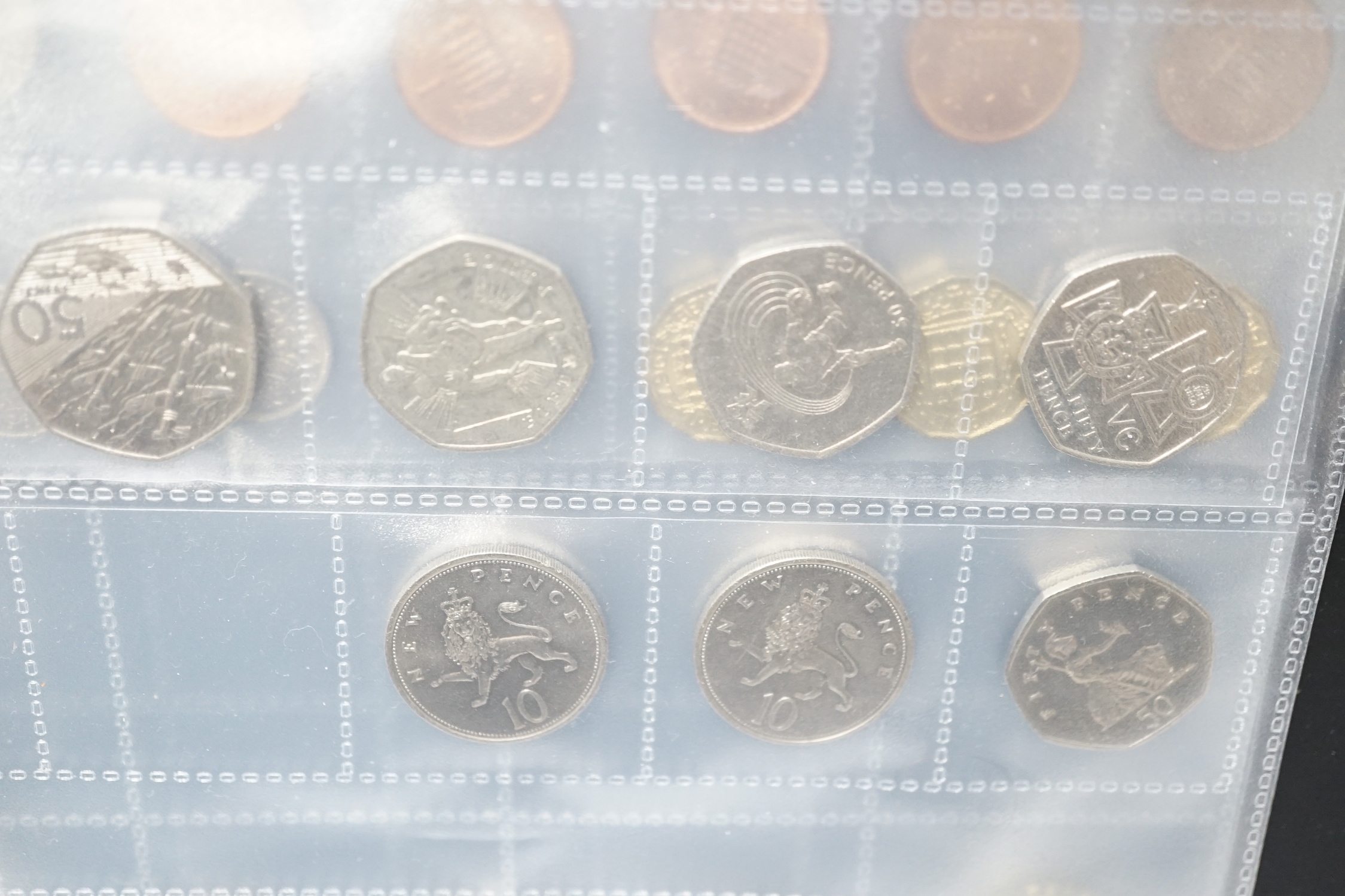 A stamp album, alphabetically mounted by country, mostly early 20th century, including some Commonwealth mounted mint, together with an album of mainly British coinage, 20th century, but includes two Roman AR denarius